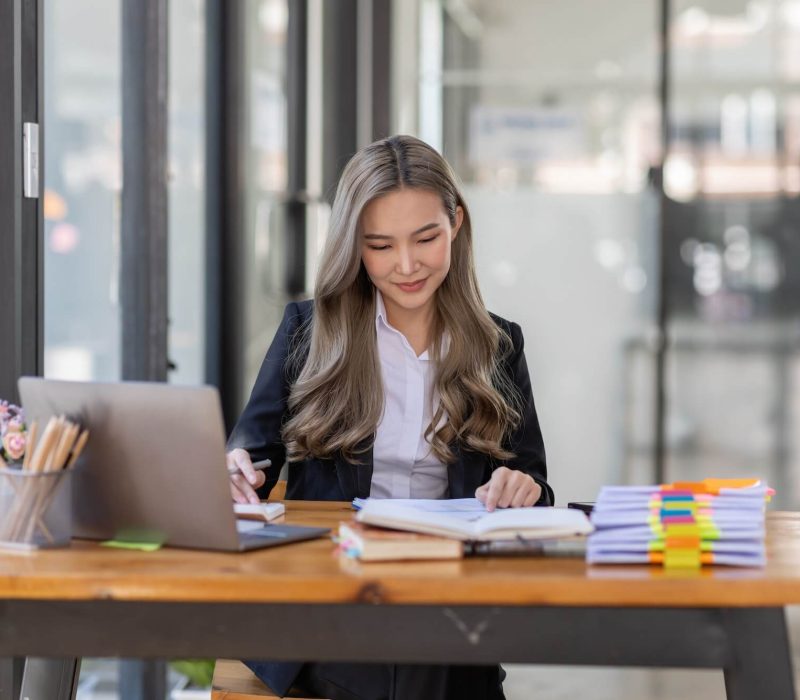 business-asian-woman-or-accountant-bookkeeper-working-on-calculator-to-calculate-business-data-.jpg